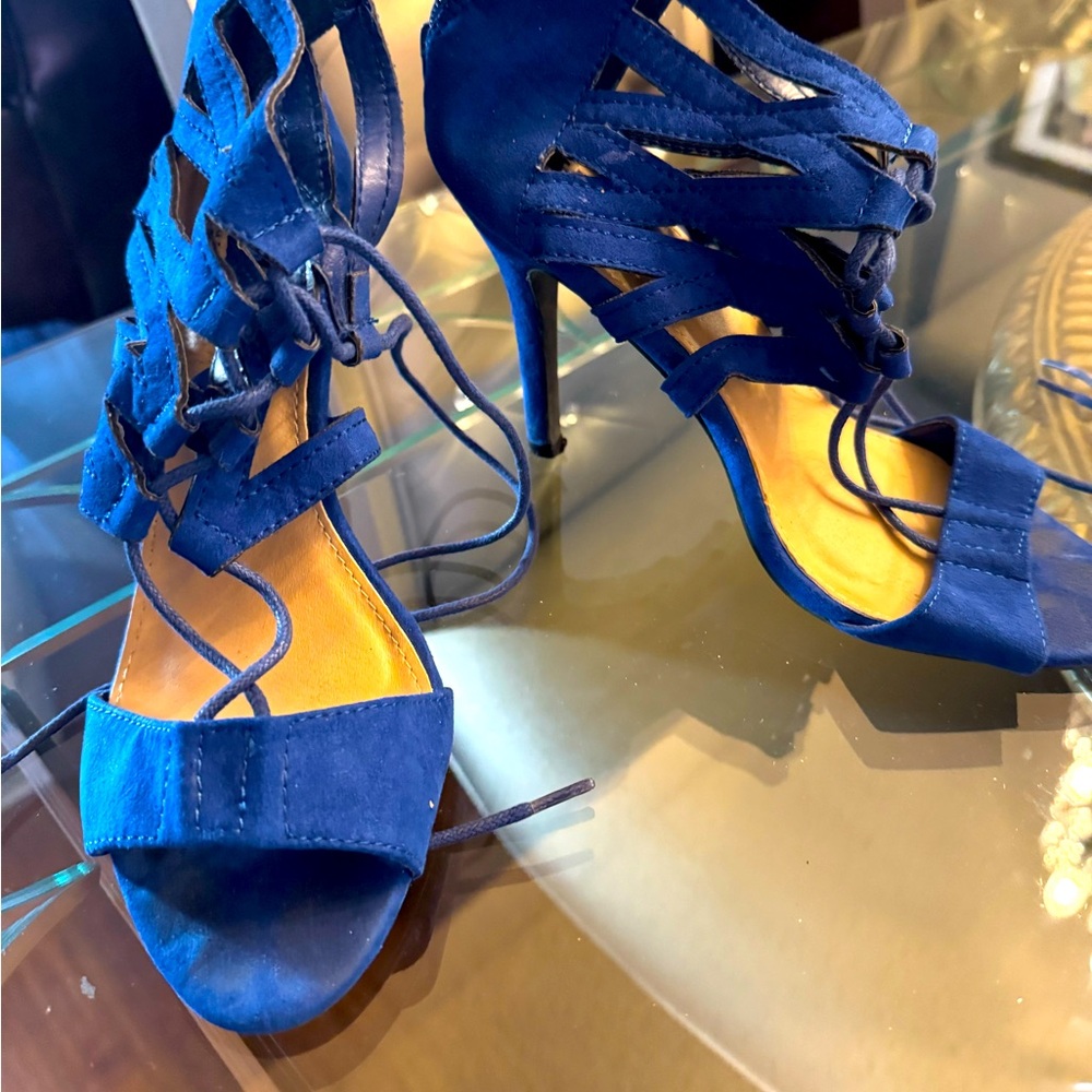 A blue open toe sandal with straps